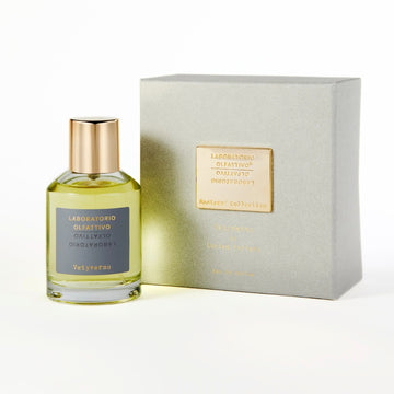 Vetyverso Masters' Collection By Laboratorio Olfattivo 100ml Eau de Parfum in a glass bottle with a gold cap with a light grey colored minimalist and elegant typographic label; light grey square box, with a gold foil embossed label.